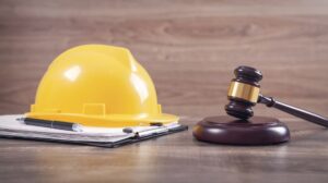 Judge's gavel and safety helmet symbolizing Construction Law. 