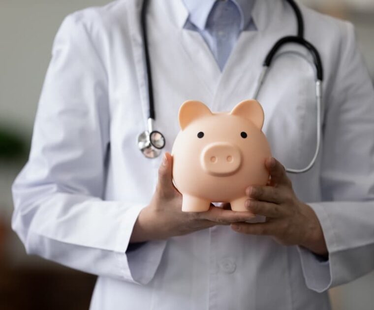 female doctor physician nurse wearing white uniform with stethoscope holding pink piggy bank, medical insurance concept, healthcare and medicine, hospital budget, clinic fees